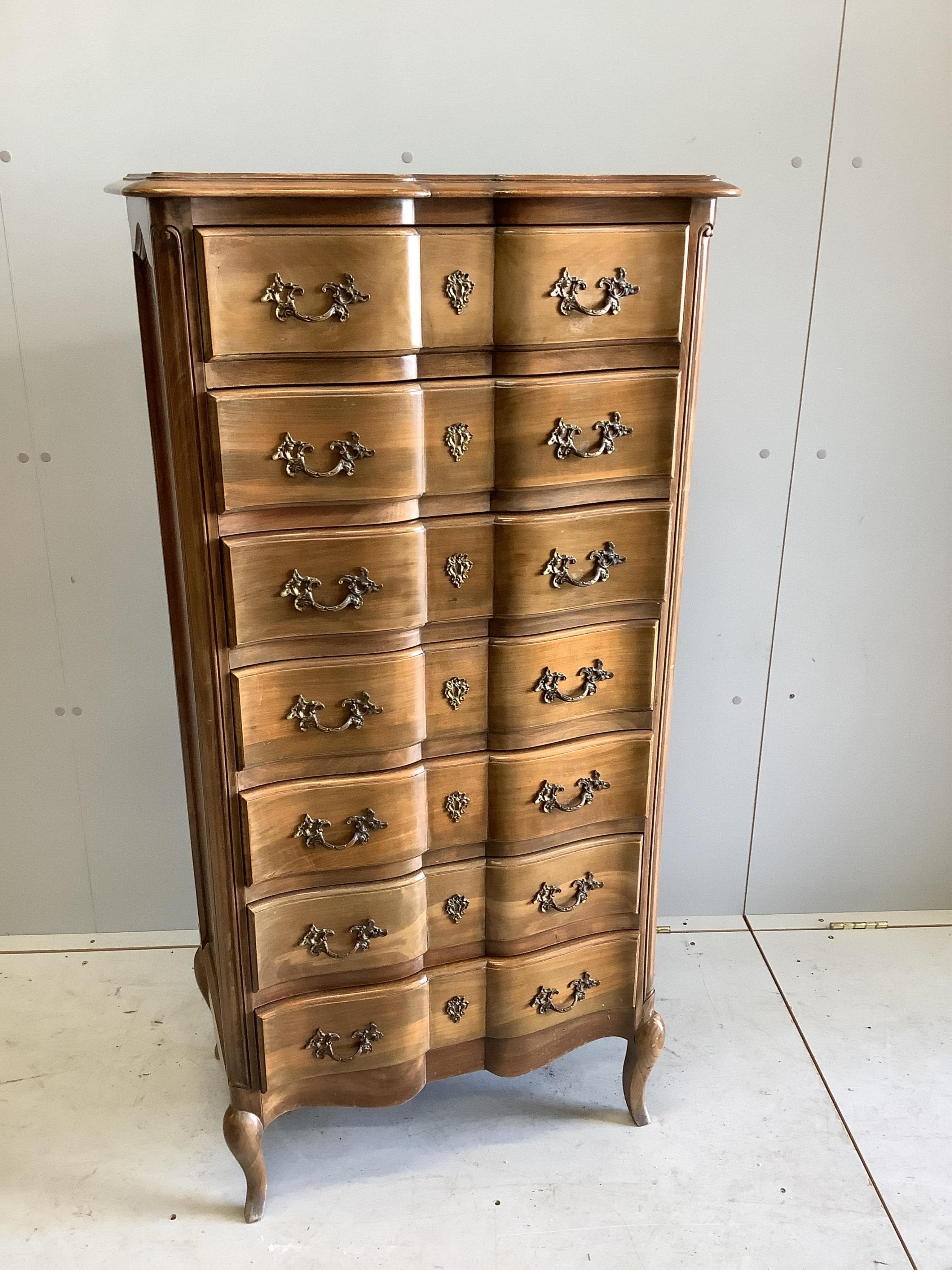 A French stained beech Semanier with seven drawers, width 66cm, height 130cm. Condition - a little faded, otherwise good